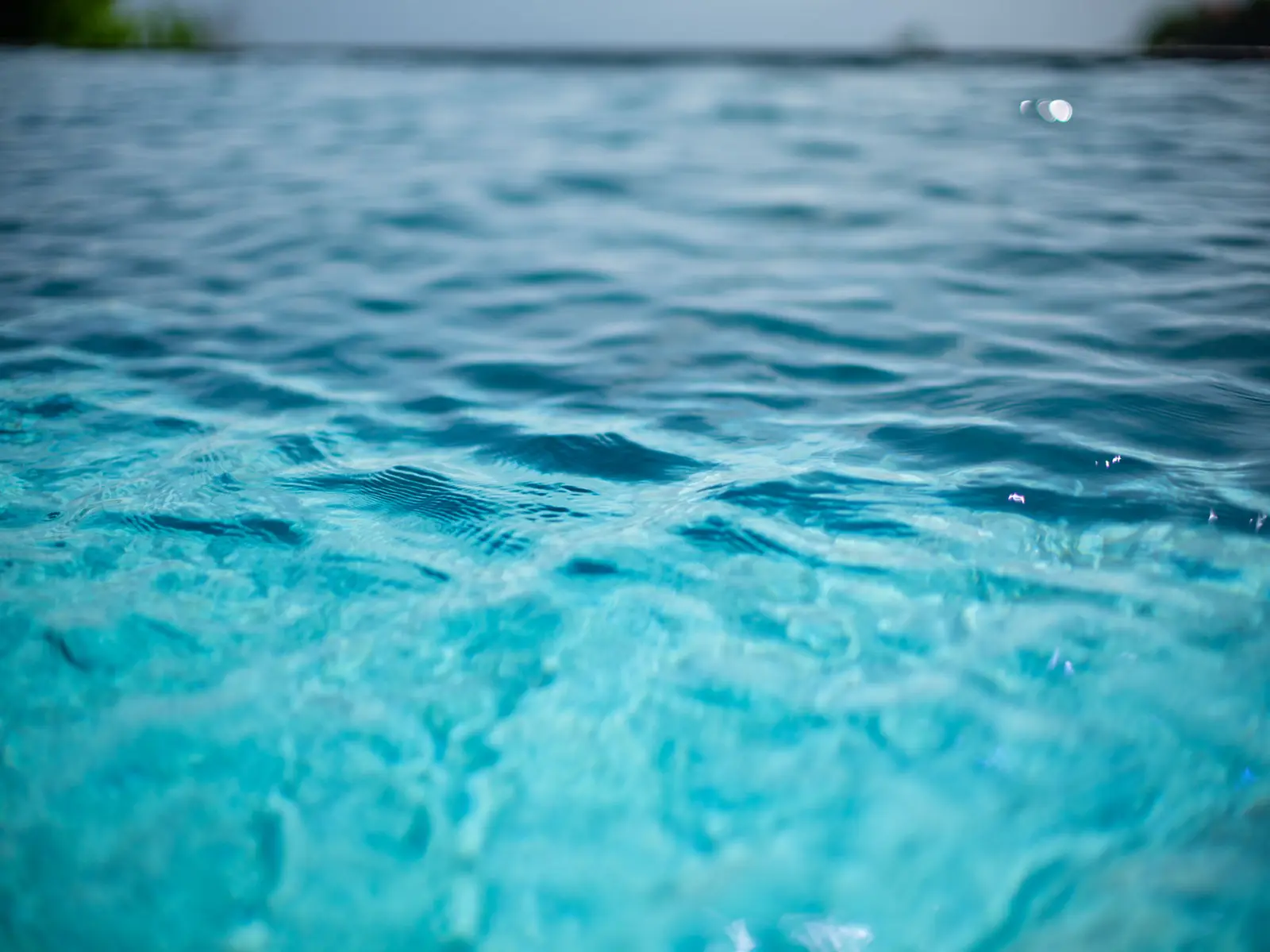Clear blue pool water surface